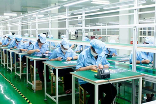 Sunder battery production line with workers assembling rechargeable battery packs